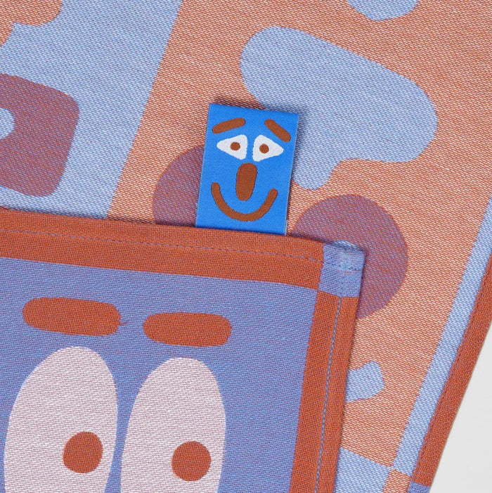 "MAKING FACES" TEA TOWEL — by Cari Vander Yacht